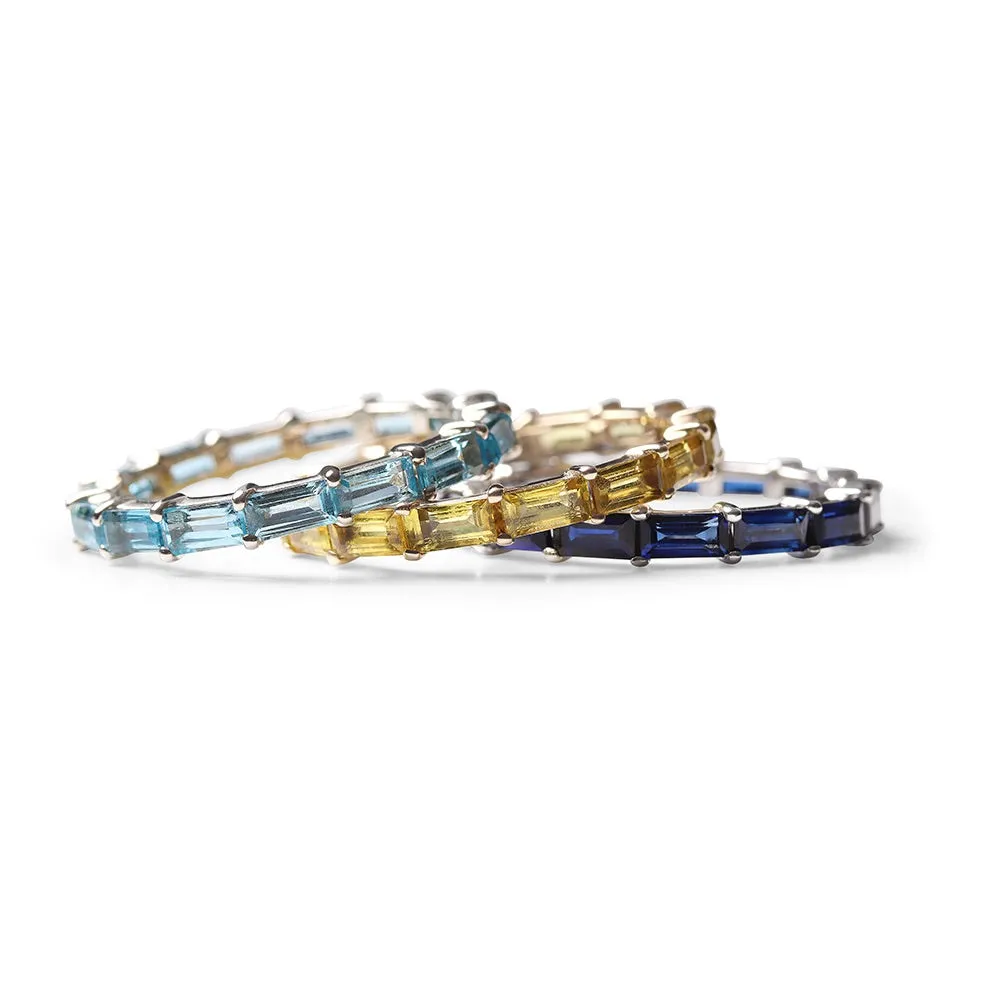 BLUE TOPAZ BAGUETTE ETERNITY BAND