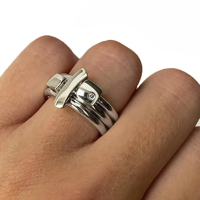 Polished silver ring with diamond and silver detail